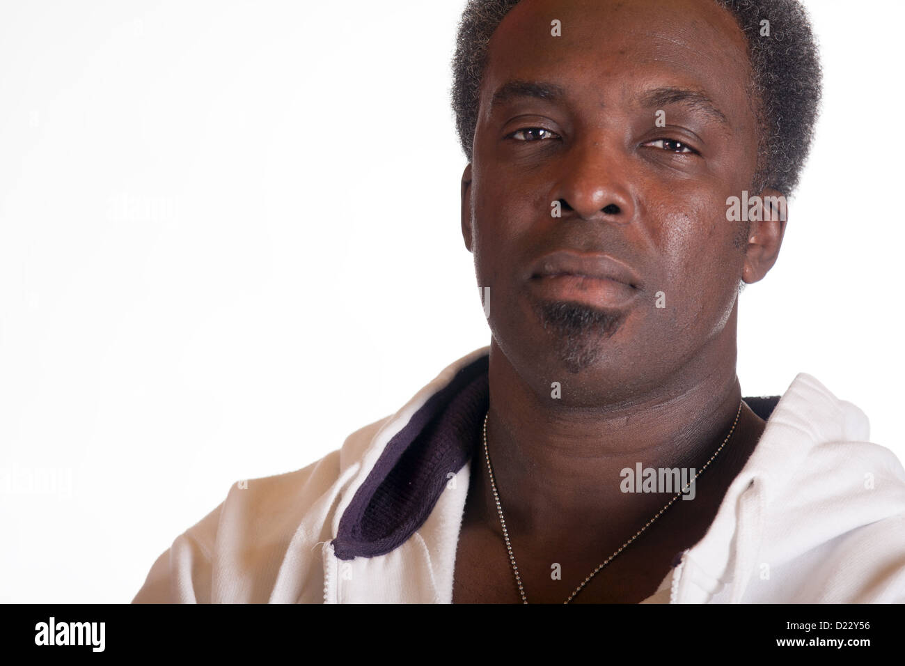head shot portrait of american gangster in sweat suit Stock Photo
