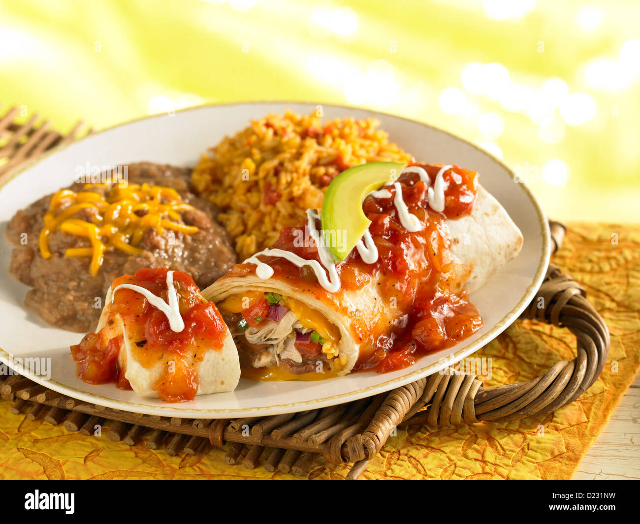 Chicken wet burrito with refried beans and Spanish rice Stock Photo Alamy