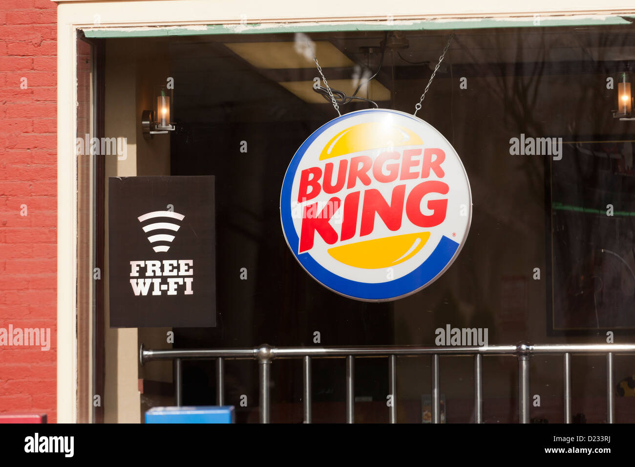 Burger King restaurant window with free WiFi service sign Stock Photo