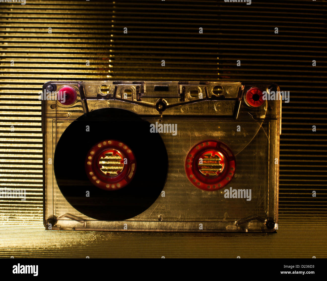 Transparent Cassette tape. Gold color background Stock Photo - Alamy