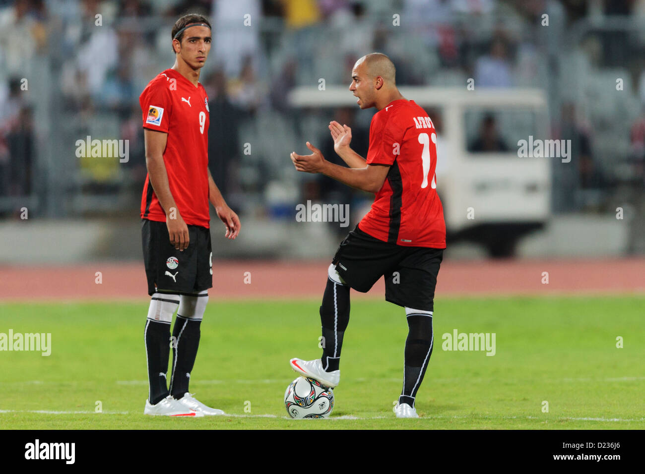 Mohamed Talaat (L) and Afroto (R) of Egypt prepare to kick off the second half of the opening match of the FIFA U-20 World Cup. Stock Photo
