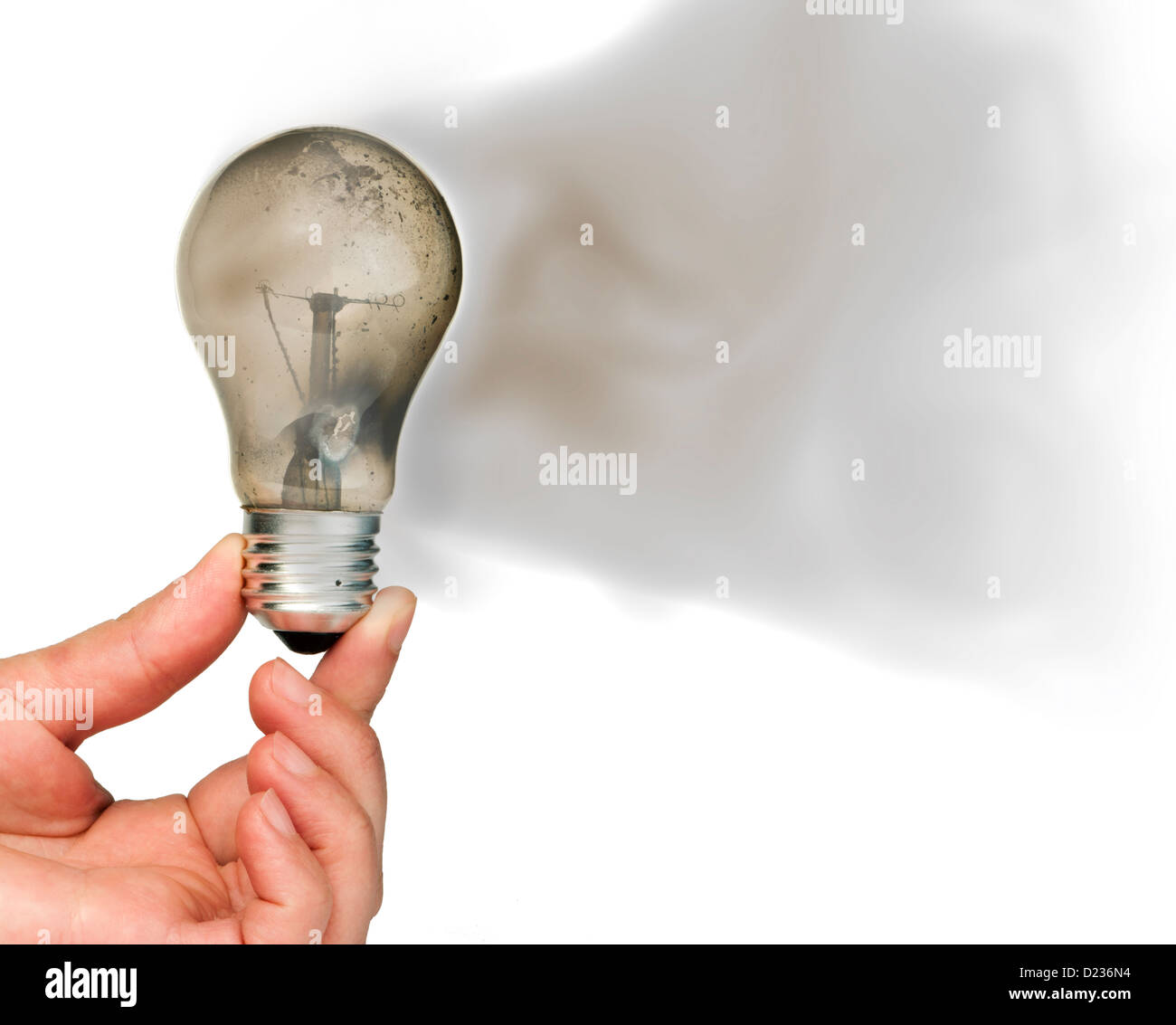 Old light bulb burned inside and smoke Stock Photo Alamy