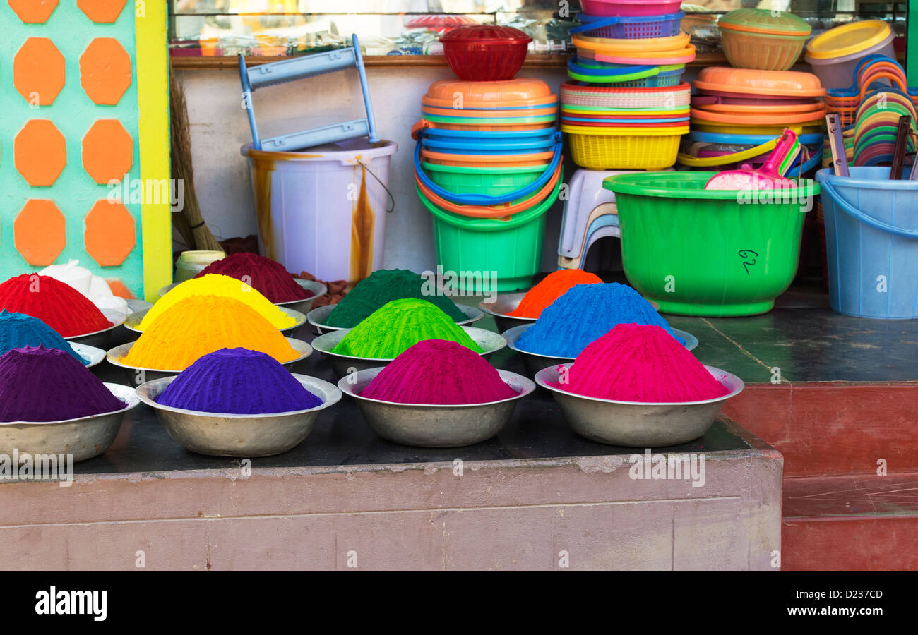 Coloured Indian powder in metal bowls used for making rangoli designs at festivals. Andhra Pradesh, India Stock Photo
