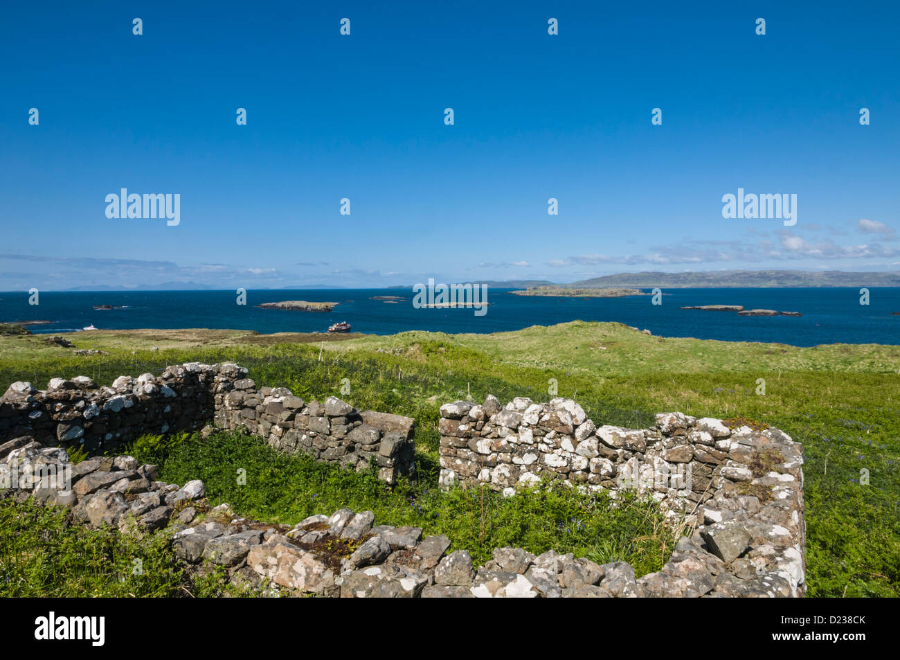 Ruined farm stead Lunga Treshnish Islands Argyll & Bute looking over to Isle of Mull Scotland Stock Photo