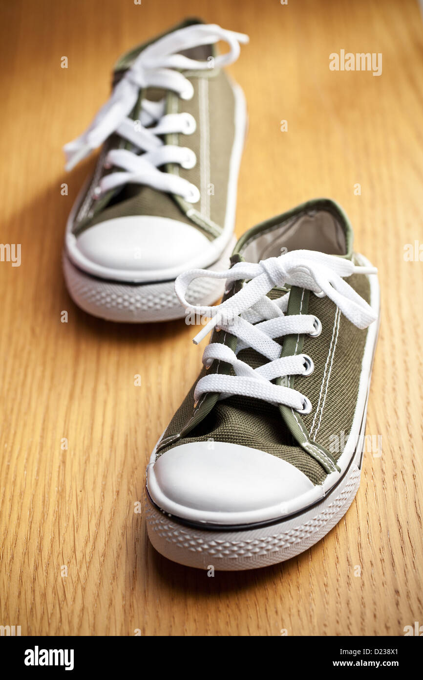 the colorful sneakers on wooden floor Stock Photo - Alamy