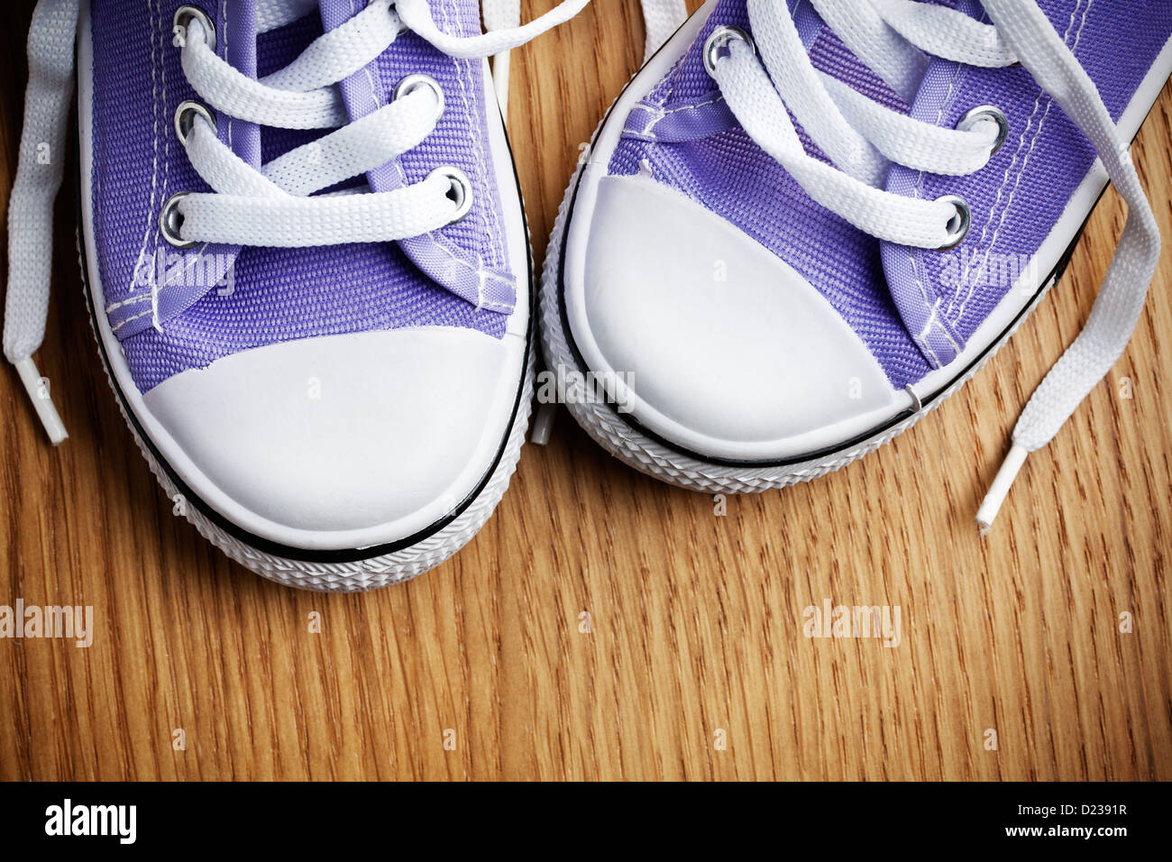 the colorful sneakers on wooden floor Stock Photo - Alamy