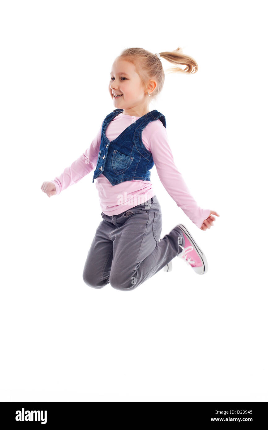 the happy little girl jumping in air Stock Photo - Alamy
