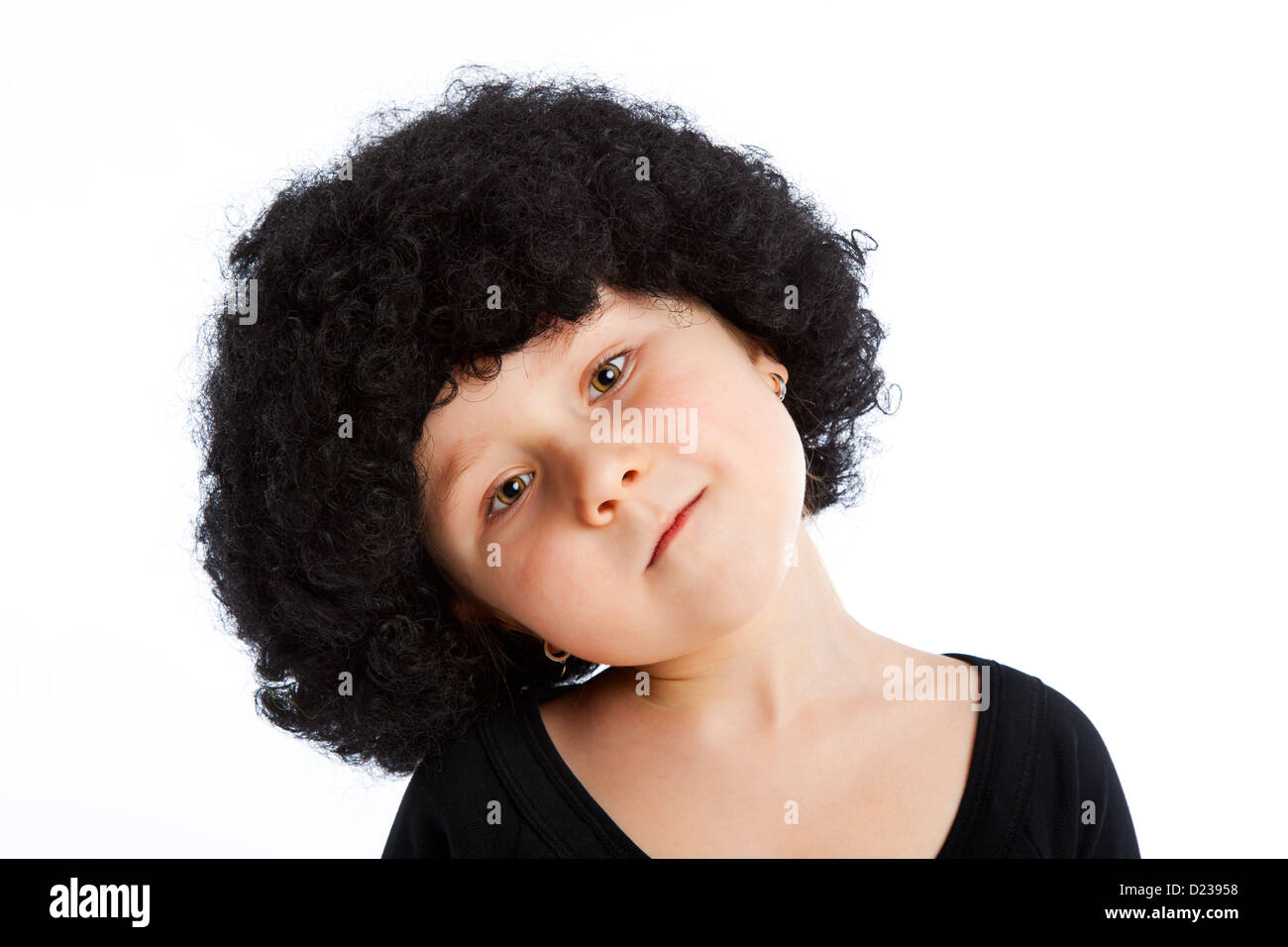 Portrait of girl child with afro wig. Stock Photo