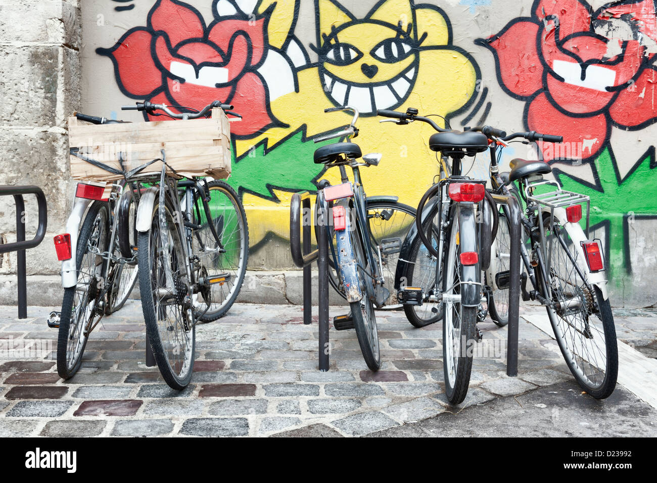 PARIS, FRANCE: Old bicycles parked haphazardly on the street Stock Photo