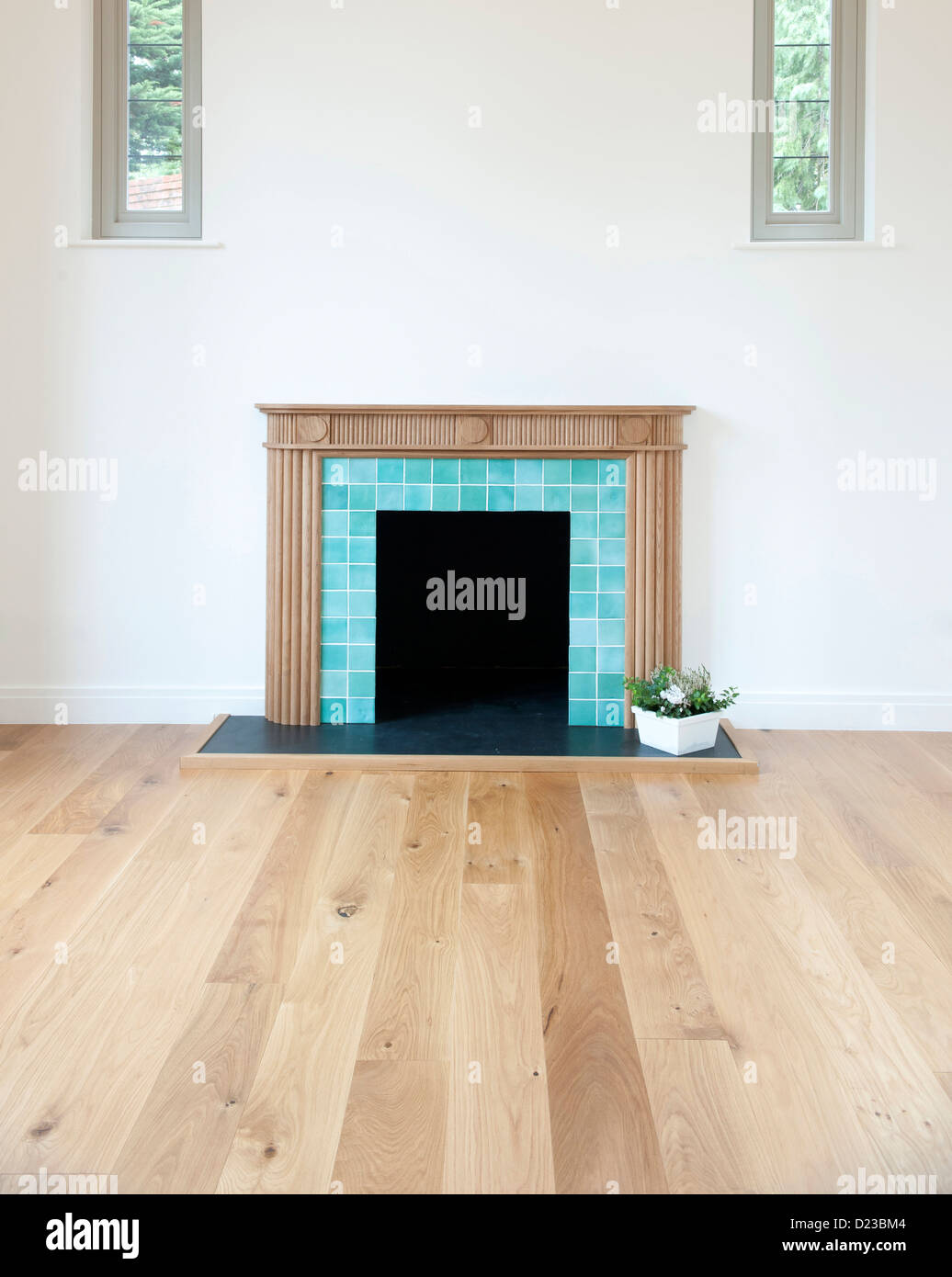 A fireplace with bare floorboards Stock Photo Alamy
