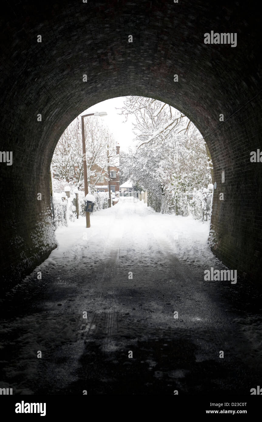 A snowy scene seen through a tunnel Stock Photo - Alamy