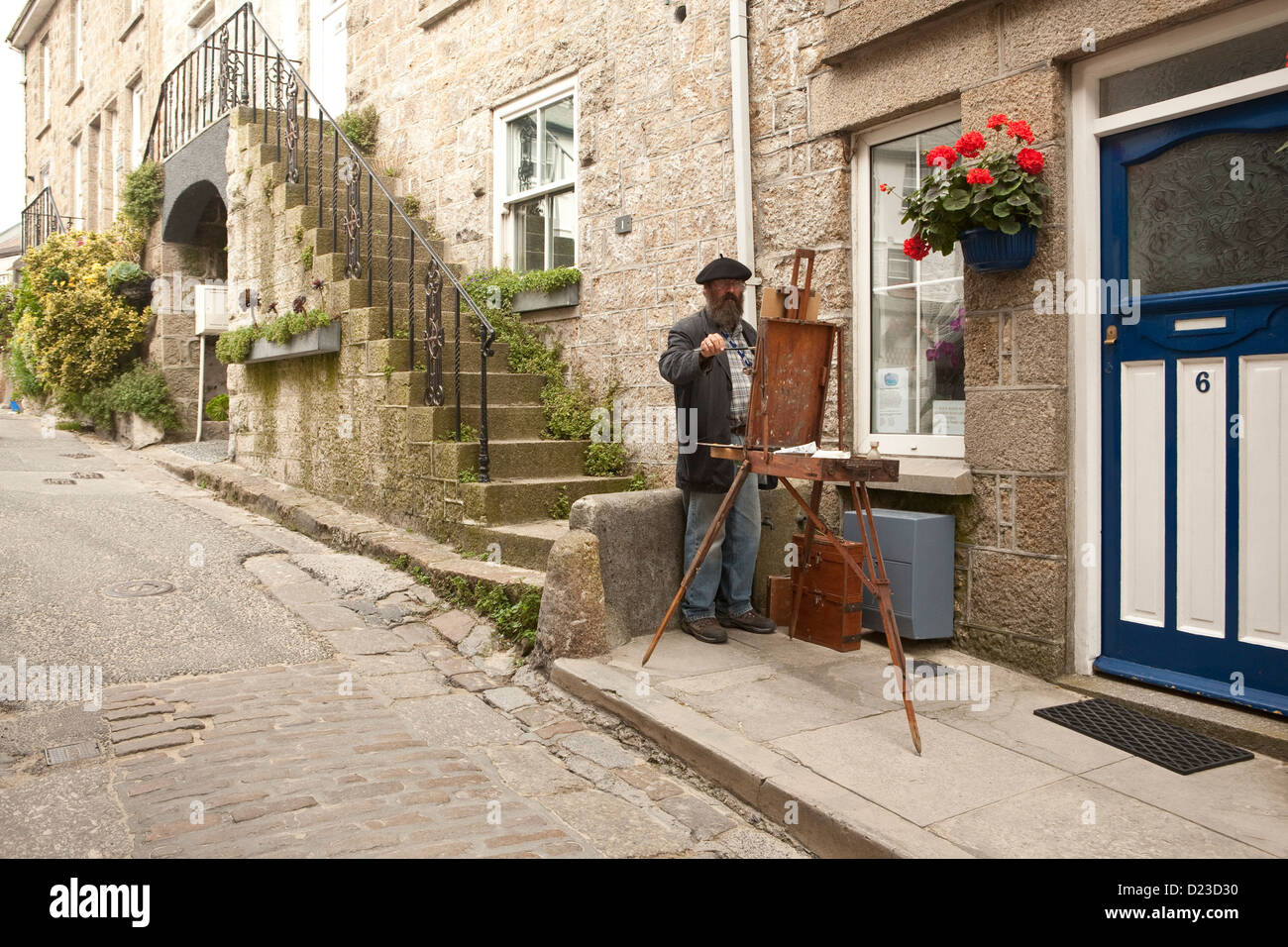 Artist at work on streets of St Ives, Cornwall Stock Photo