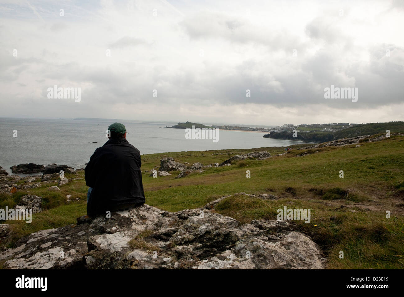 person looking out over the sea at St Ives, Cornwall Stock Photo