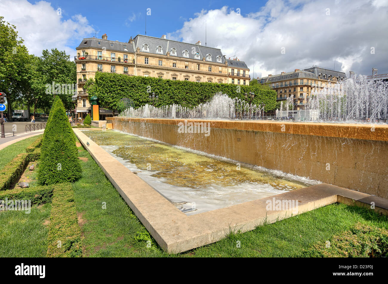 Fountains, green lawns and typical parisian building around famous Hotel de Ville in Paris, France. Stock Photo