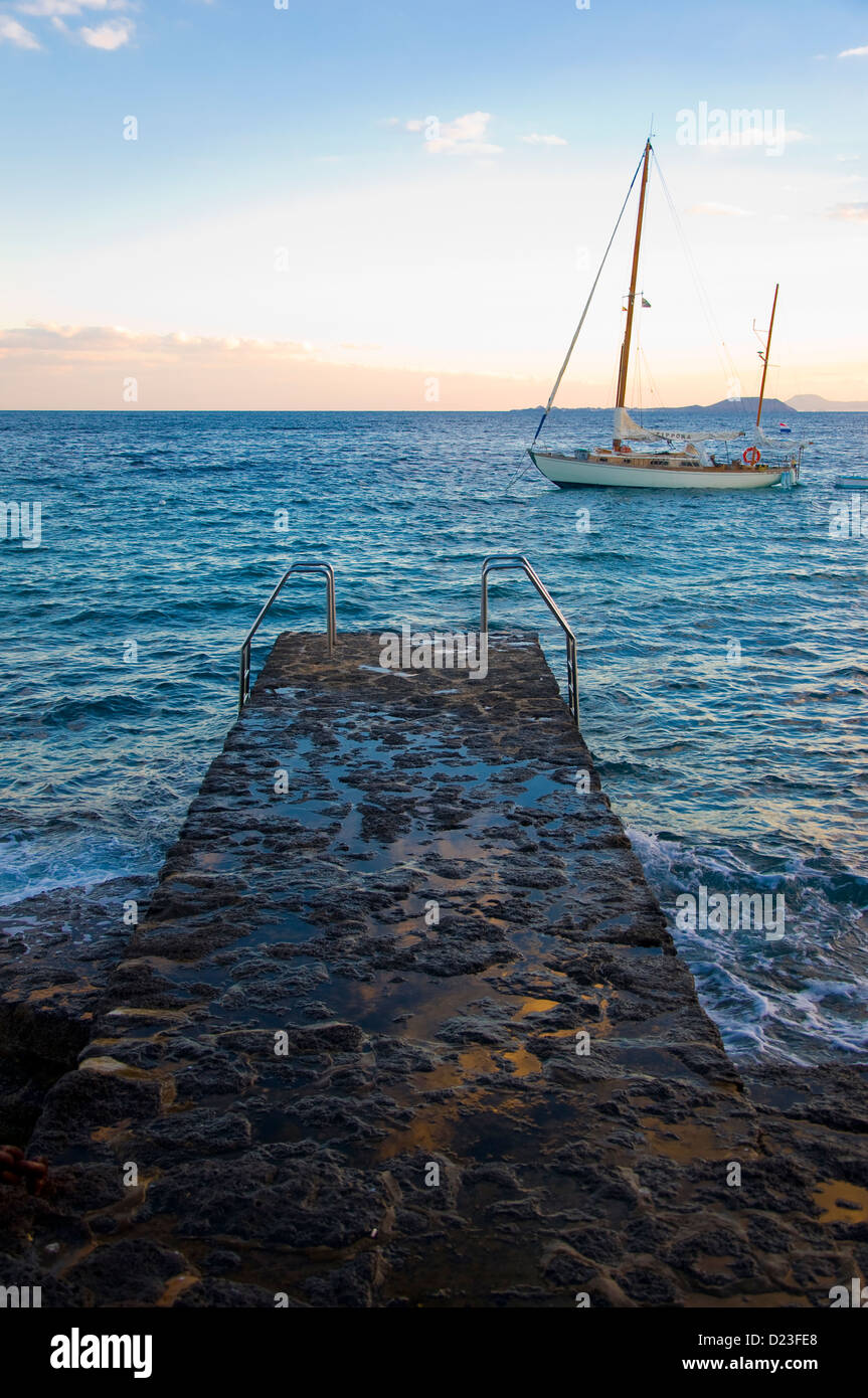Sail boat and pier, Playa Blanca, Lanzarote, Spain Stock Photo Alamy