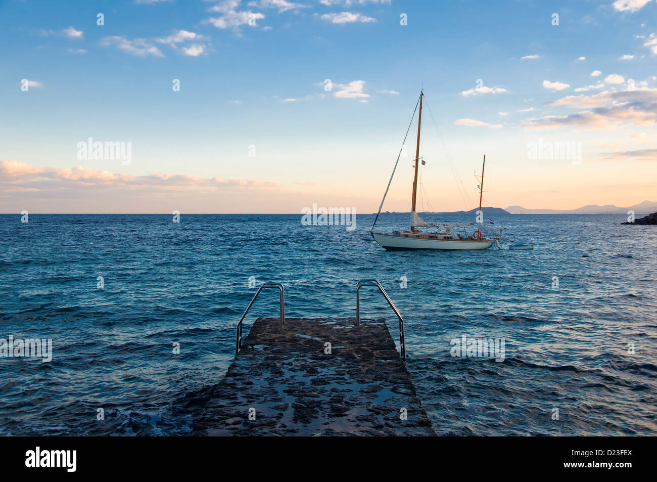 Sail boat and pier, Playa Blanca, Lanzarote, Spain Stock Photo Alamy