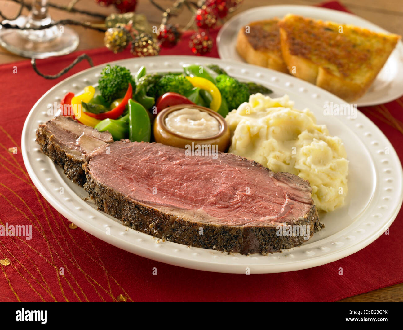 Prime Rib Dinner With Mashed Potatoes And Vegetables In A Holiday Setting Stock Photo Alamy