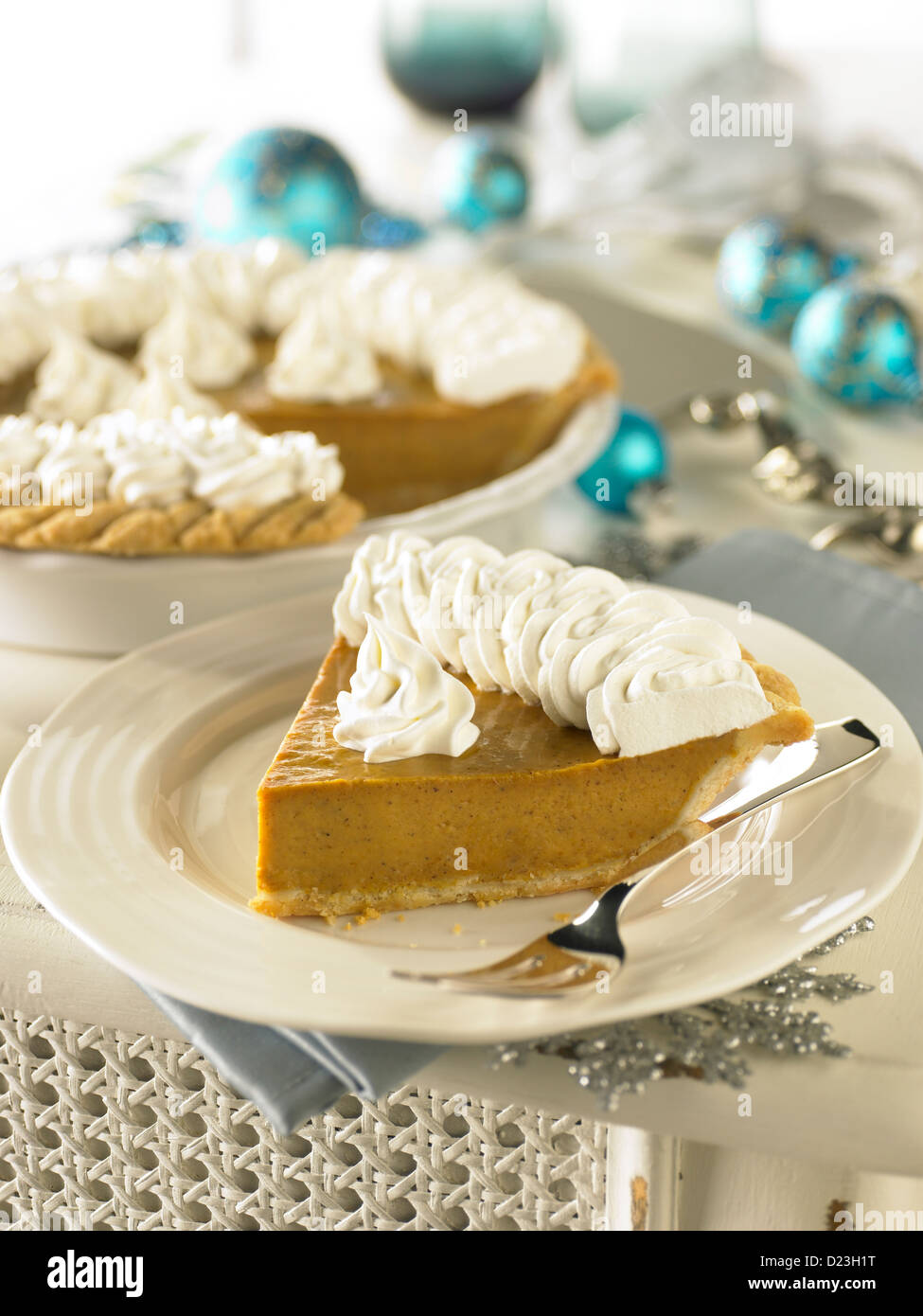 Pumpkin pie in a holiday setting Stock Photo
