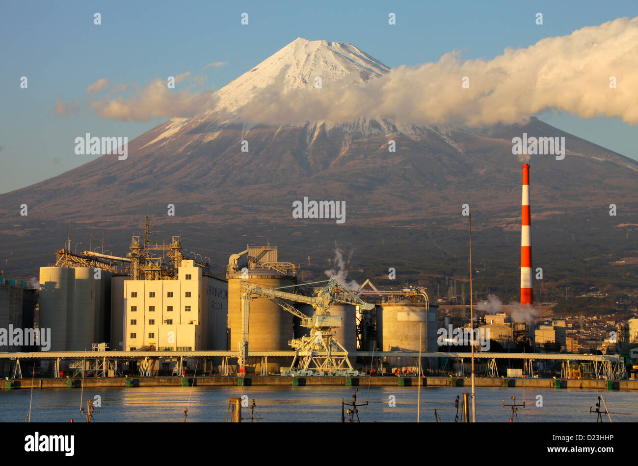 Mount Fuji and factories at Tagonoura harbor Shizuoka Japan Stock Photo
