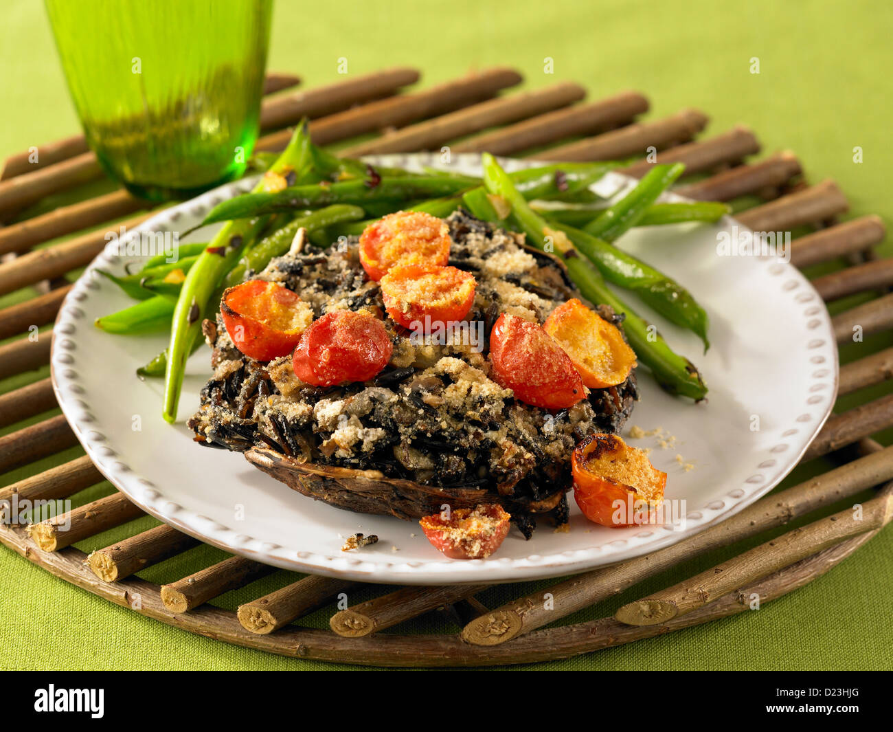 Stuffed mushrooms with grilled tomatoes and green beans Stock Photo