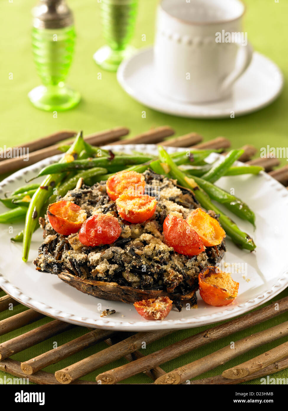 Stuffed mushrooms with grilled tomatoes and green beans Stock Photo