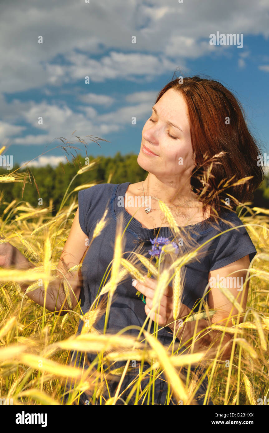 Woman in a wheat field Stock Photo - Alamy