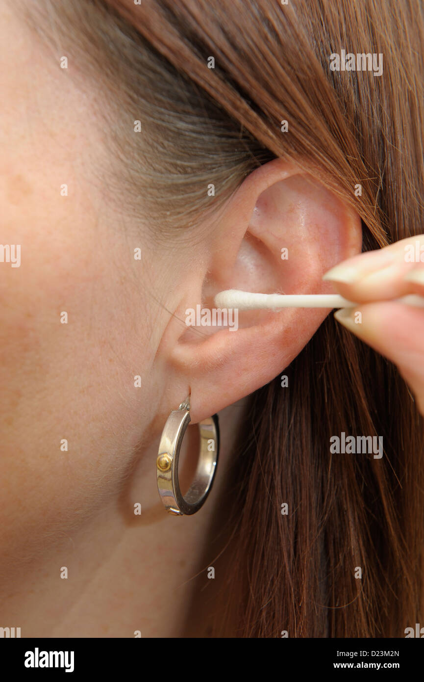 female using cotton ear bud Stock Photo Alamy