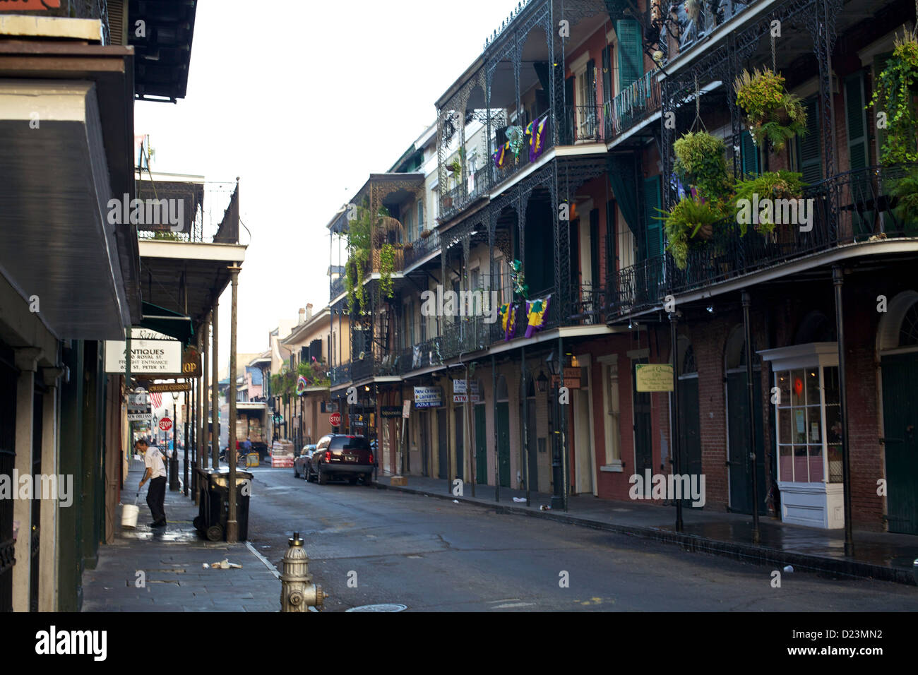 Morning in New Orleans' French Quarter with historic iron balconies, colorful plants, and vibrant streets reflecting the charm of this iconic district Stock Photo