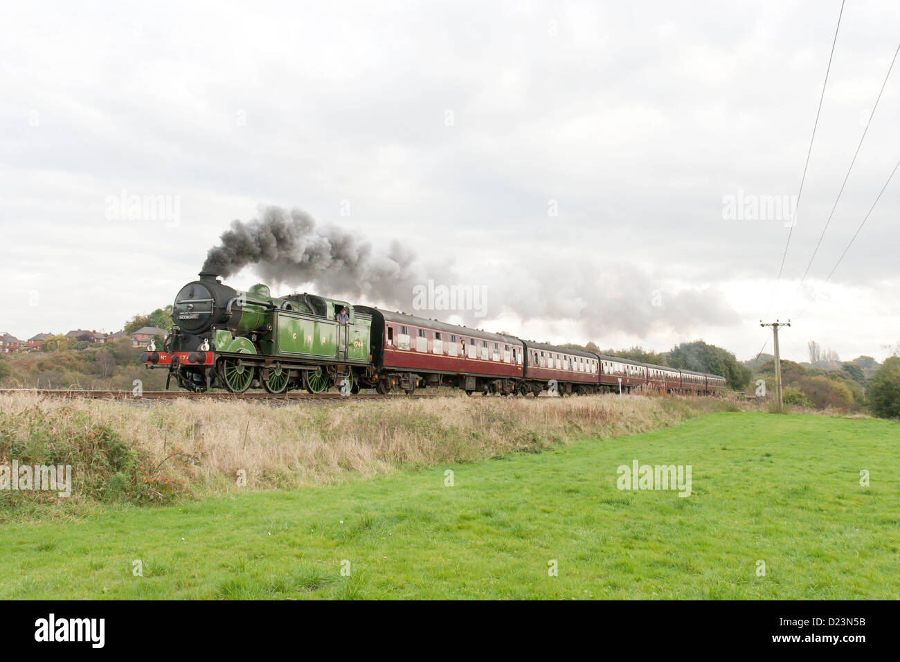 Steam locomotive pulling a passenger train on the East Lancs Railway at Burrs Stock Photo