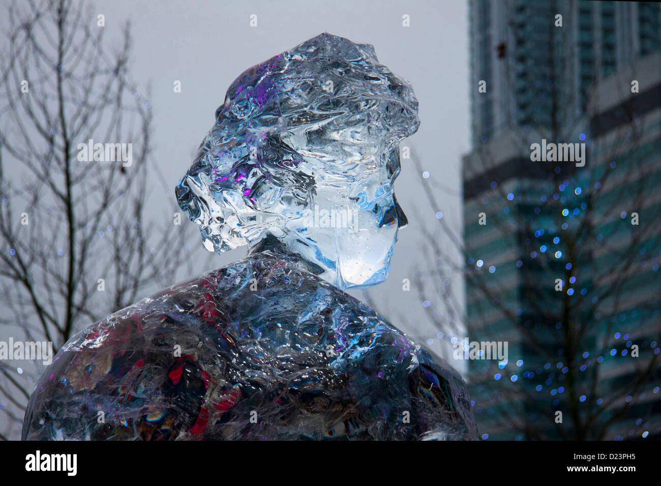 Carved ice sculpture of woman at Canary Wharf Ice Festival, London Stock Photo