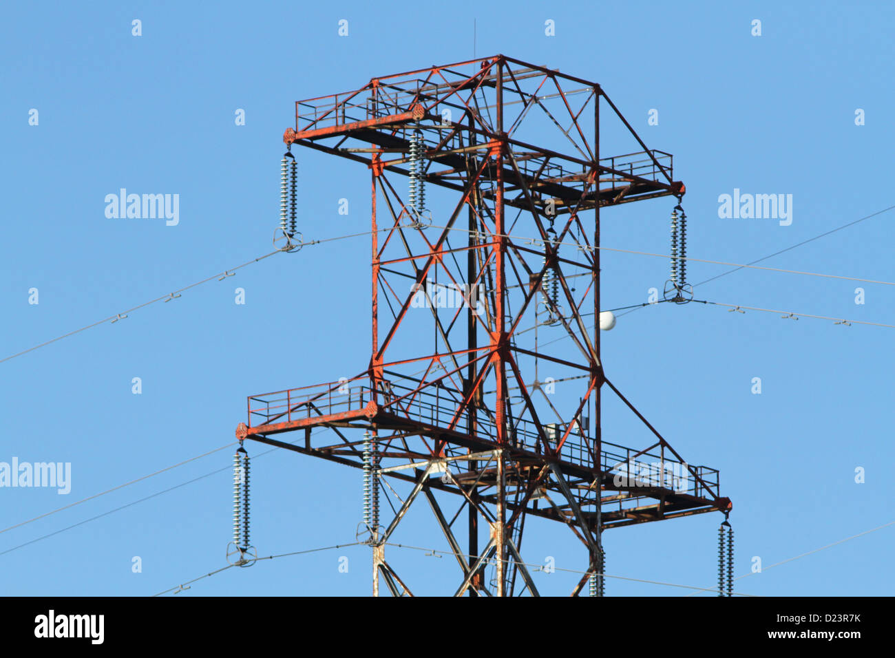 Electricity pylons against a blue sky in the sunset Stock Photo - Alamy