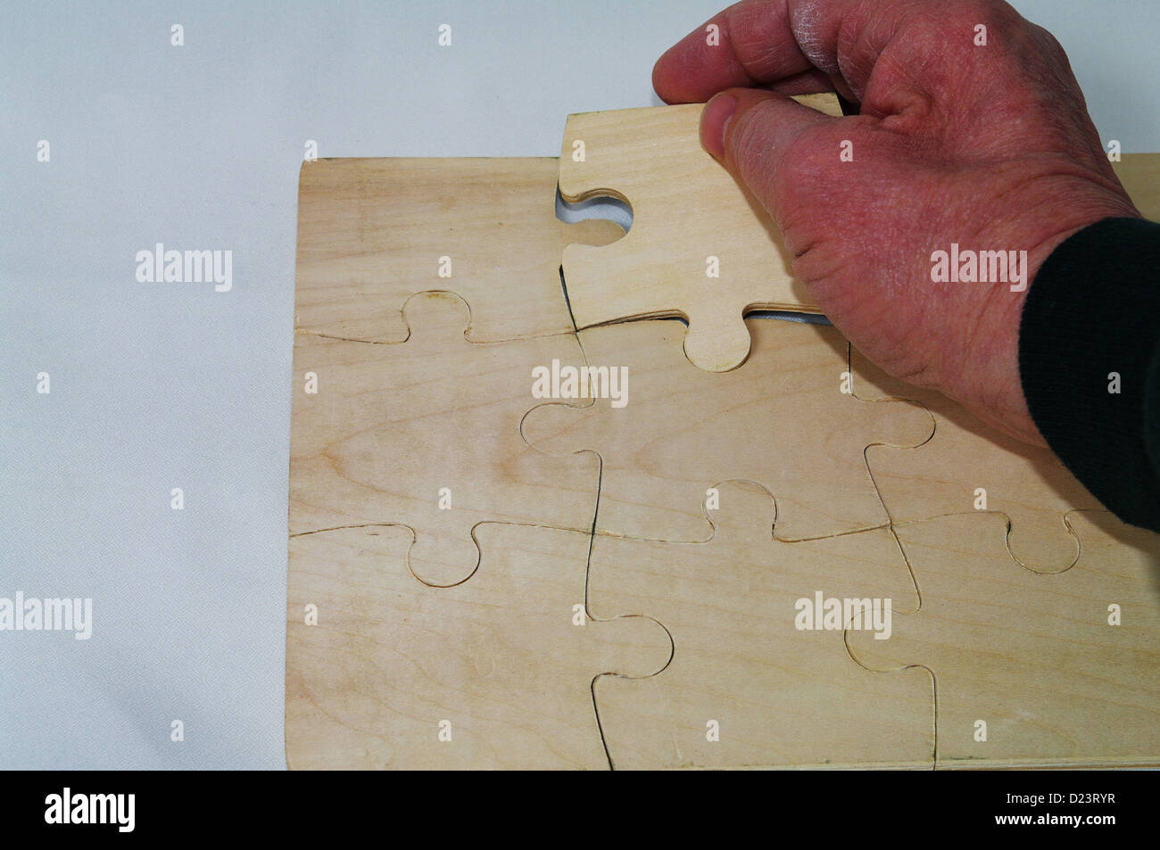 A puzzle being put together Stock Photo Alamy