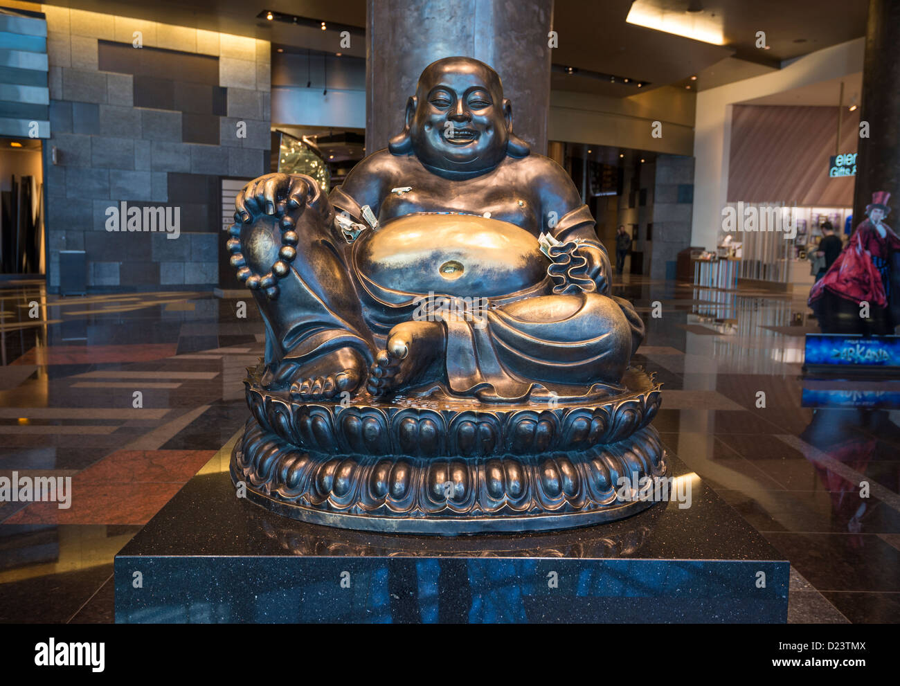 A large bronze Buddha statue at the north entrance of Aria Resort and