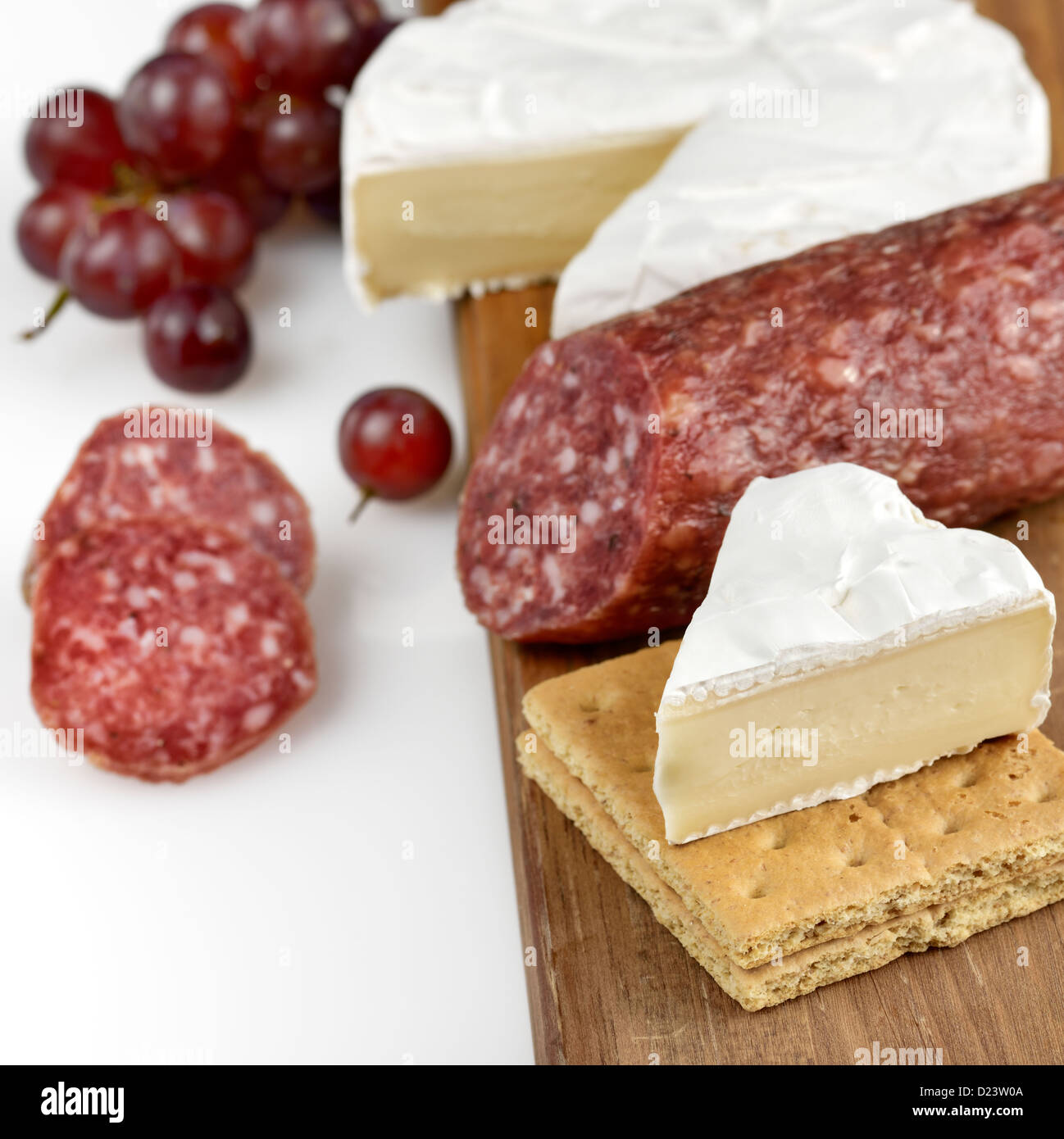 Brie Cheese And Salami On A Wooden Board Stock Photo Alamy