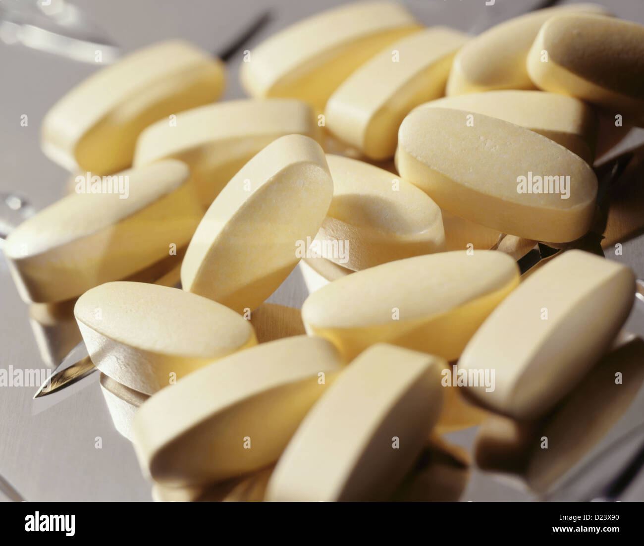 A pile of vitamin c on stainless steel Stock Photo