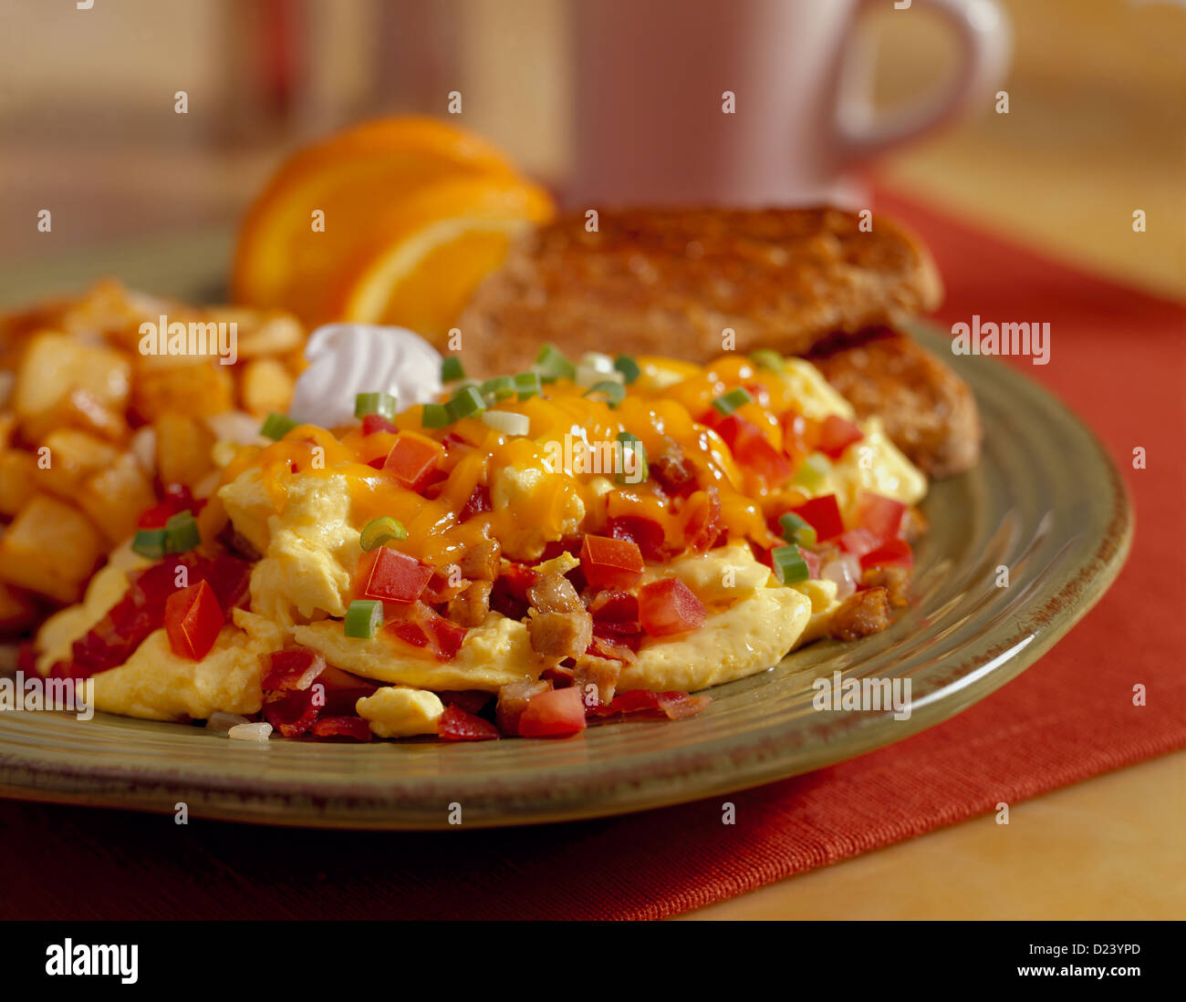 Scrambled Eggs With Tomato Bacon And Melted Cheese Topped With Sour Cream And Green Onions And Served With Toast And Potatoes Stock Photo Alamy Scrambled Eggs With Tomato Bacon And Melted Cheese Topped With Sour Cream And Green Onions And Served With Toast And Potatoes Stock Photo Alamy