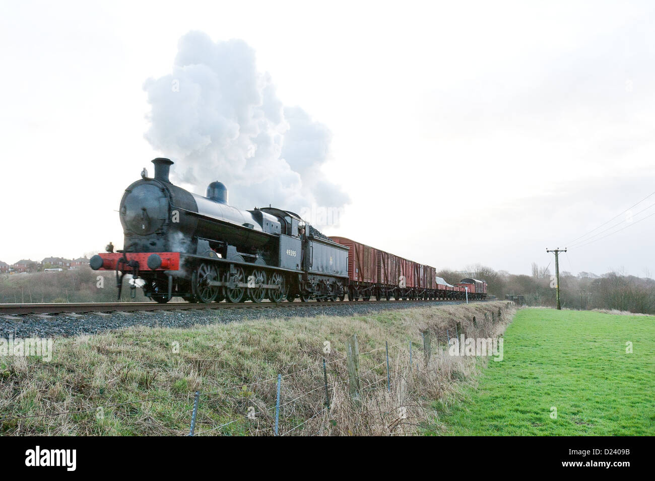 Steam locomotive pulling a goods train on the East Lancs Railway at Burrs Stock Photo