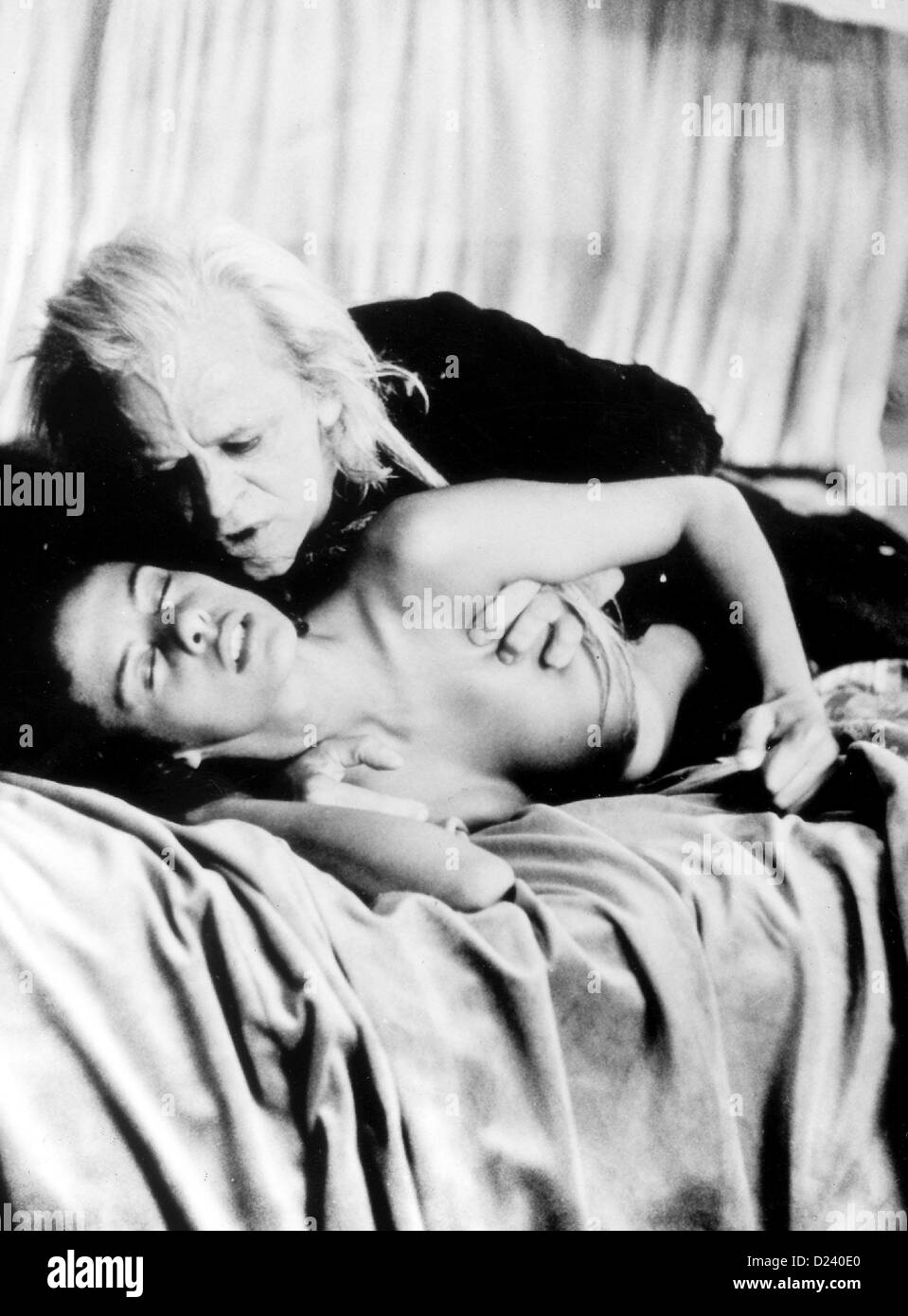 Actor Klaus Kinski as blood sucking vampire Nosferatur (film scene) bends over a beautiful, young woman (played by Anne Knecht) in "Nosferatu in Venice". The enfant terrible of German dramamatic art would have celebrated his 75th birthday on the 18th of October in 2001. Furthermore, is is his 10th anniversary of death on the 23rd of November. Stock Photo