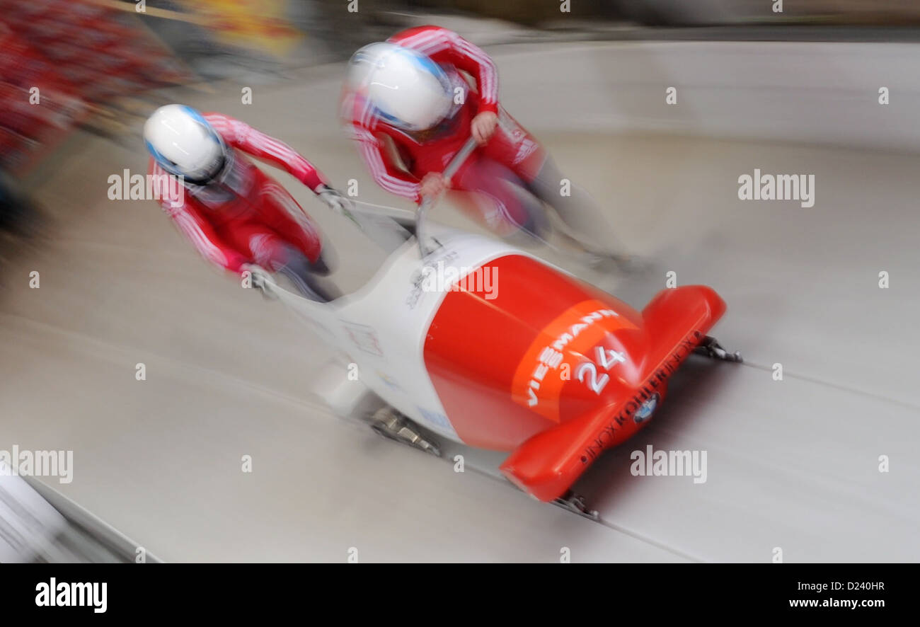 Swiss bobbers Caroline Spahni (R) and her brakewoman Ariane Walser start a run at the women's two-person bobsleigh world cup at the artificial ice track at Koenigssee near Berchtesgarden, Germany, 11 January 2013. Photo: TOBIAS HASE Stock Photo