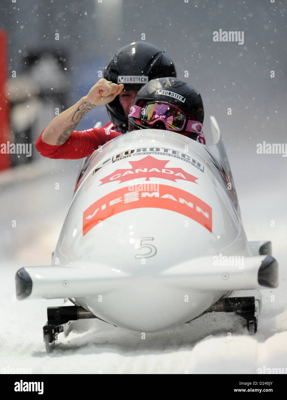 Canadian bobbers Kaillie Humphries and Chelsea Valois cross the fininshing line during the women's two-person bobsleigh world cup at the artificial ice track at Koenigssee near Berchtesgarden, Germany, 11 January 2013. Humphries and Valois gained first place. Photo: TOBIAS HASE Stock Photo