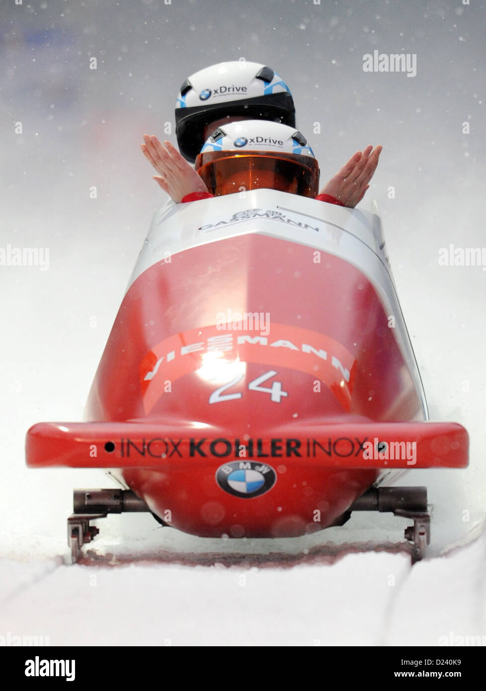 Swiss bobbers Caroline Spahni and Ariane Walser cross the fininshing line during the women's two-person bobsleigh world cup at the artificial ice track at Koenigssee near Berchtesgarden, Germany, 11 January 2013. Saphi and Walser came in sixth place. Photo: TOBIAS HASE Stock Photo