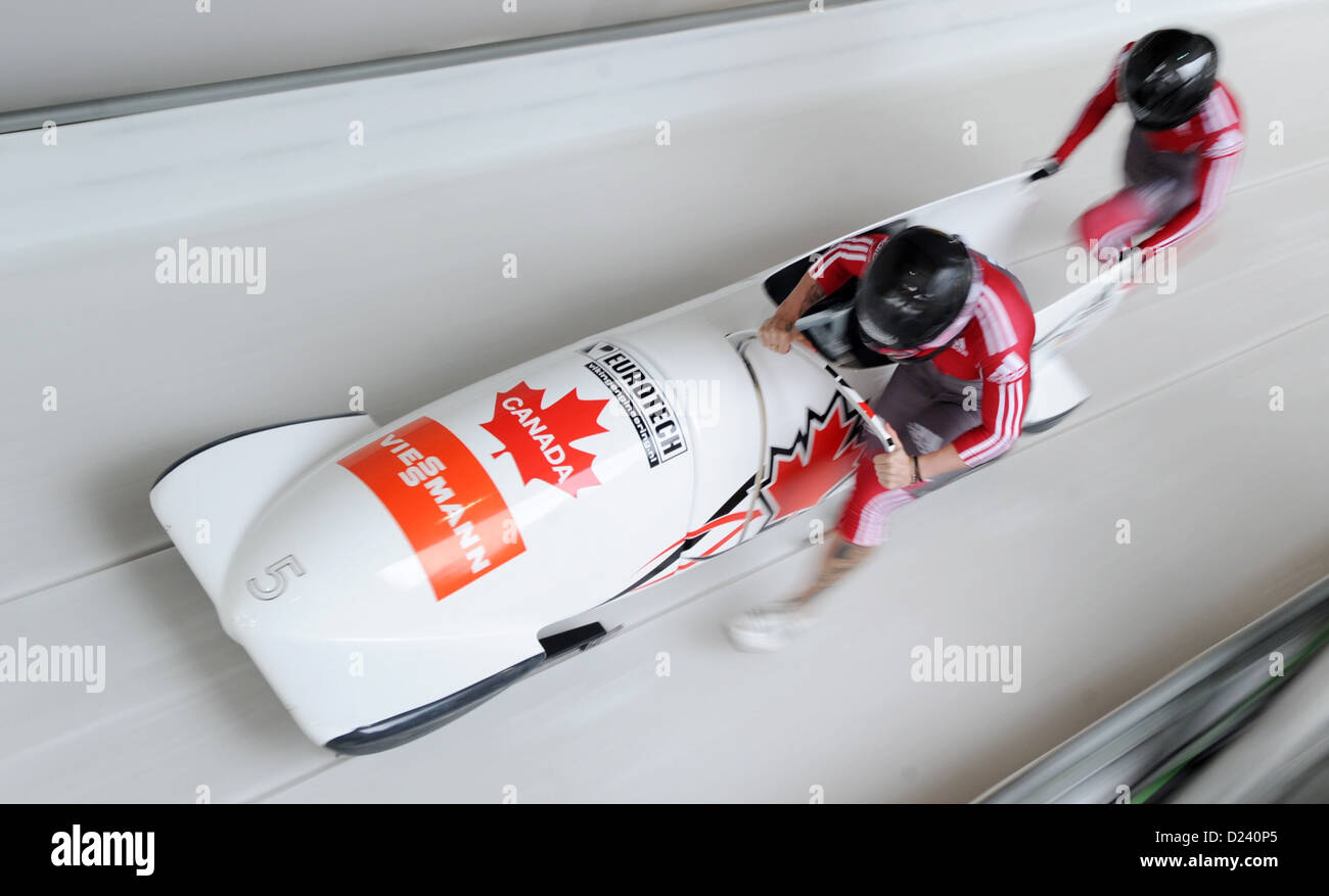 Canadian bobbers Kaillie Humphries (L) and her brakewoman Michelle Huwiler start a run at the women's two-person bobsleigh world cup at the artificial ice track at Koenigssee near Berchtesgarden, Germany, 11 January 2013. Photo: TOBIAS HASE Stock Photo