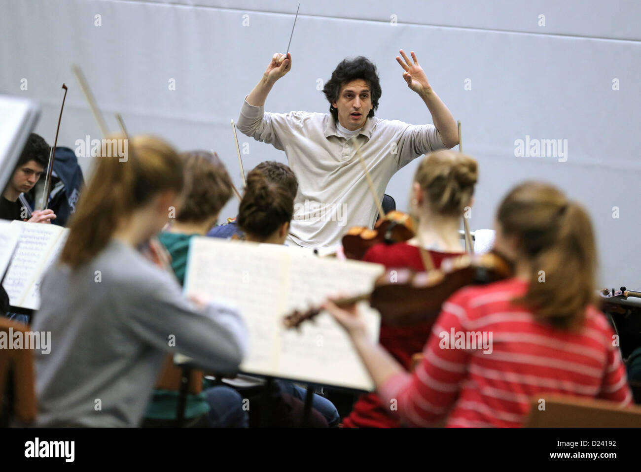 Principle conductor of Dresden's philharmonic orchestra Michael Sanderling rehearses with the federal youth orchestra in Colditz, Germany, 7 January 2013. He will tour with them through Germany and Europa on 10 January 2013. Photo: Jan Woitas Stock Photo