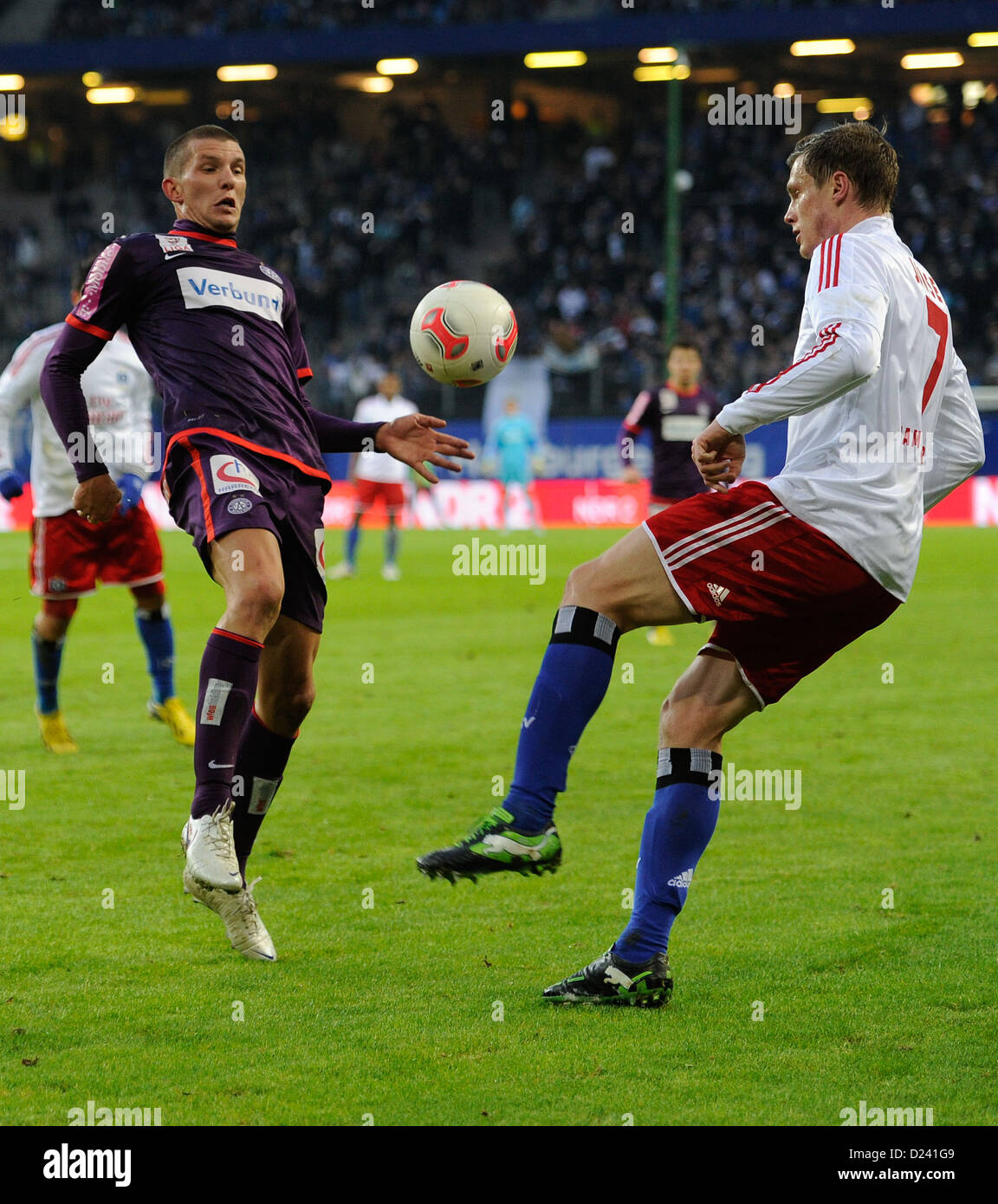 Wiens' Alexander Gorgon (L) and Hamburgs' Marcell Jansen vie for the ball during the tryout match Hamburger SV - FK Austria Wien in the Imtech-Arena in Hamburg, Germany, 12 January 2013. Photo: Axel Heimken Stock Photo