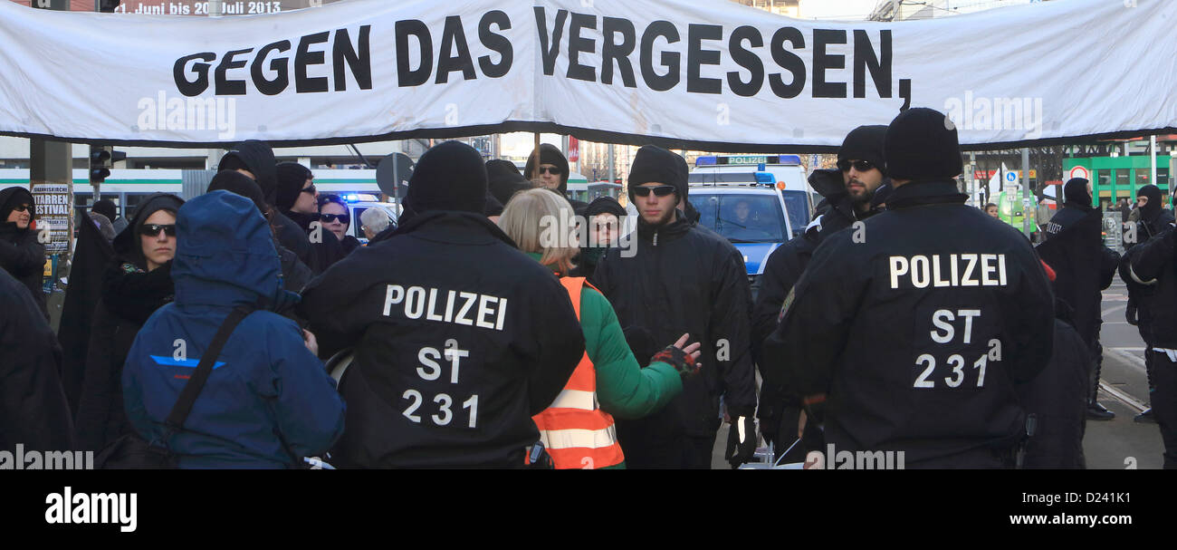 Police controls protesters against neo-Nazi march in Magdeburg, Germany, 12 January 2013. Police plans to stop conflicts between Left extremists and neo-Nazis. Background is the anniversary of the bombing of Magdeburg in the World War II on 16 January 1945. Photo: Jens Wolf Stock Photo