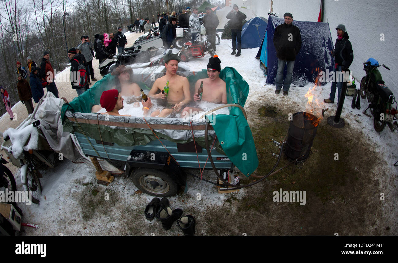 Bikers take a bath in a self-constructed bath tube in front of the Augustusburg Castle in Augustusburg, Germany, 12 January 2013. Up to 1,500 bikers from whole Europe are expected, the tradition goes back to 1971. Photo: Arno Burgi Stock Photo