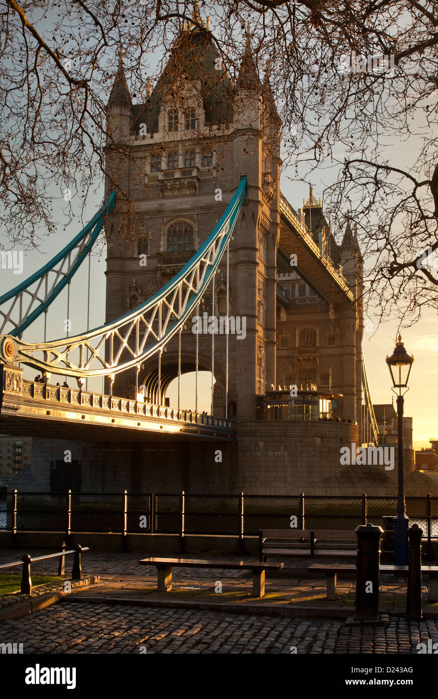 Tower Bridge in late afternoon light viewed from North side of river Thames and tower of London. Stock Photo