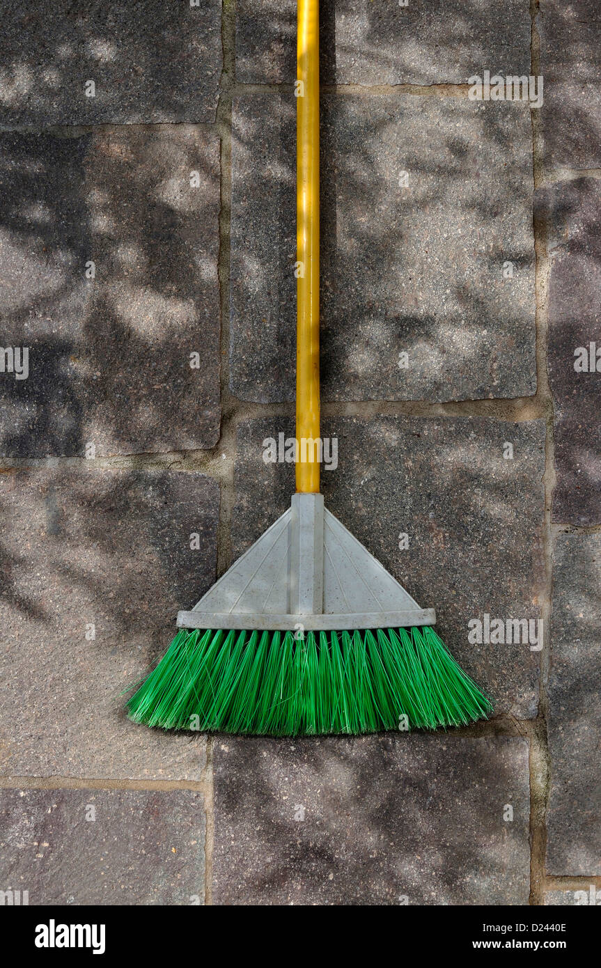 Germany, Broom laying on pavement Stock Photo Alamy
