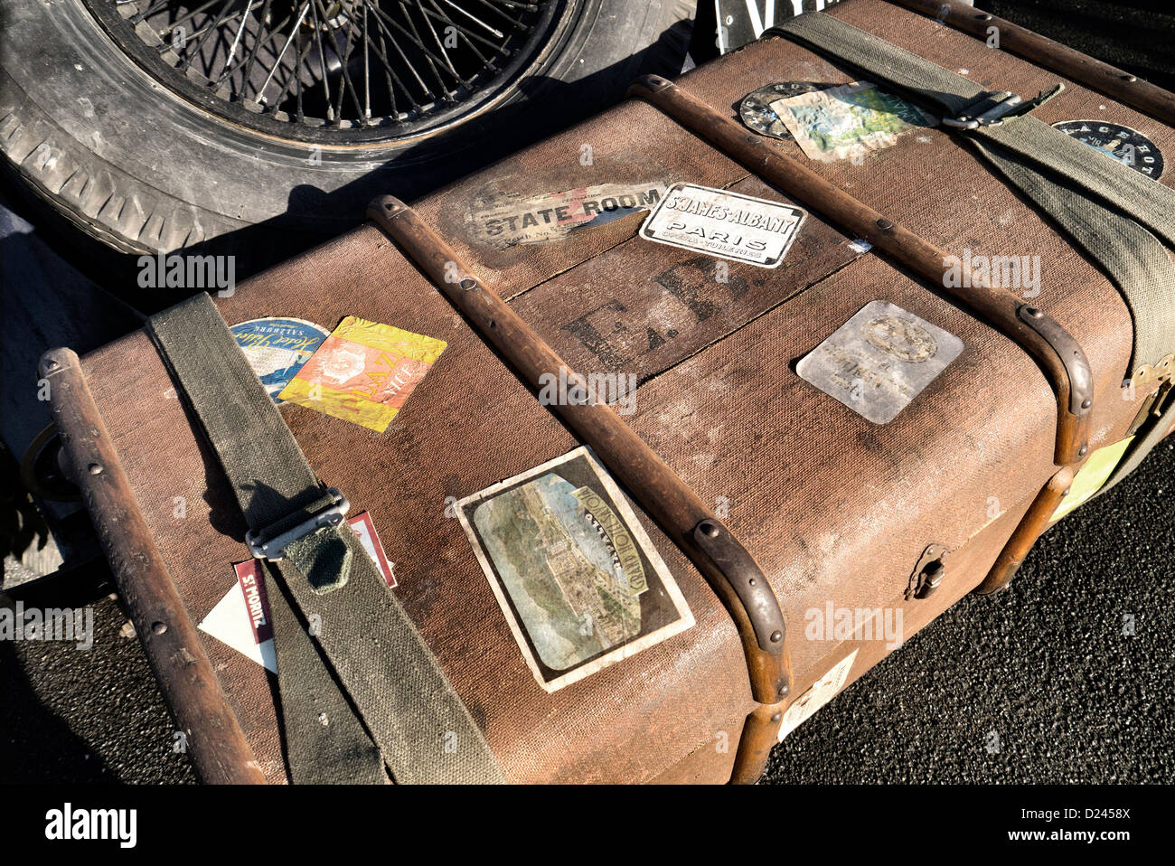 1920's luggage trunk on the back of a vintage car Stock Photo