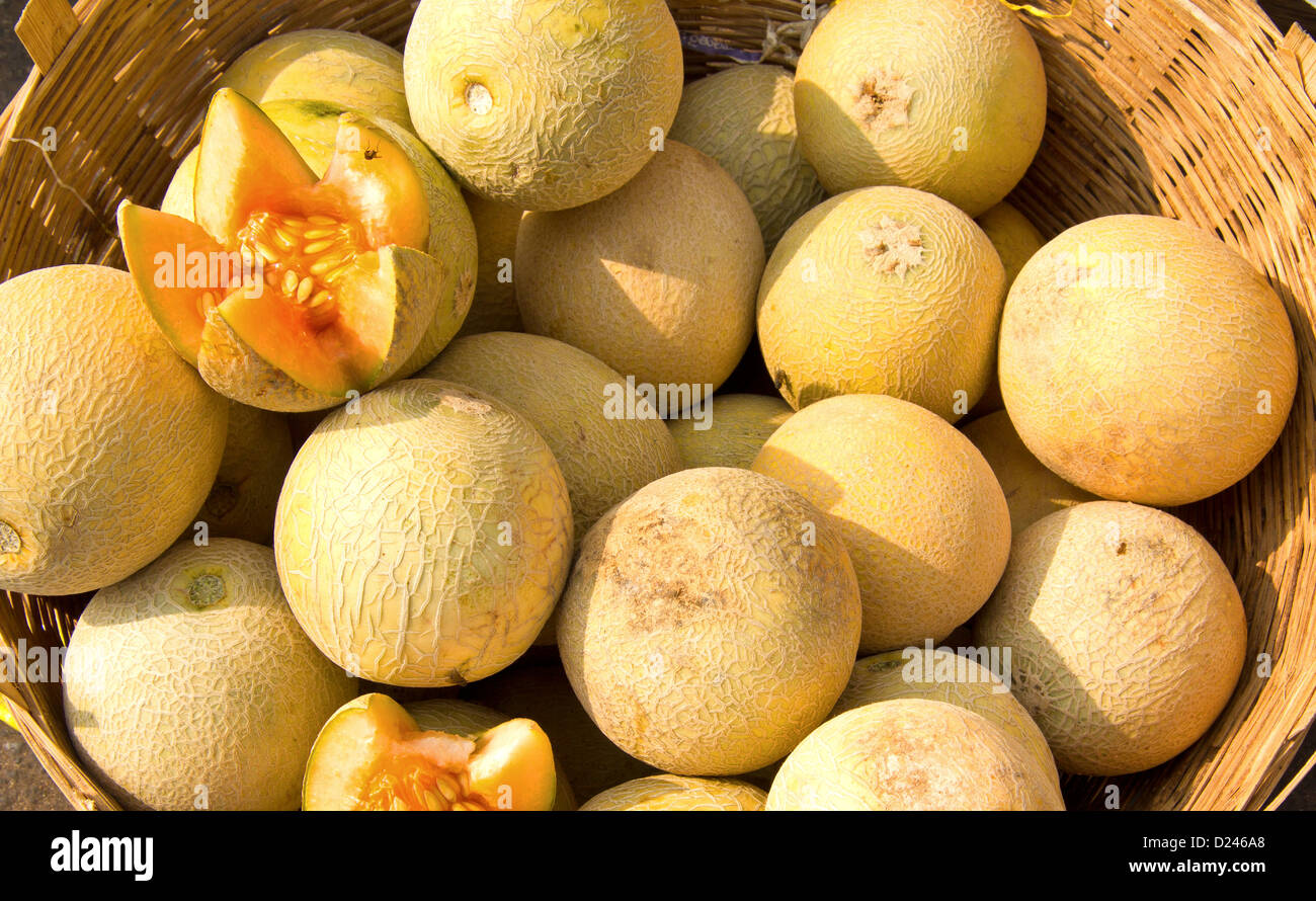 MELONS AND A VARIETY OF VEGETABLES AND FRUIT FOR SALE IN A MARKET IN SOUTHERN INDIA Stock Photo